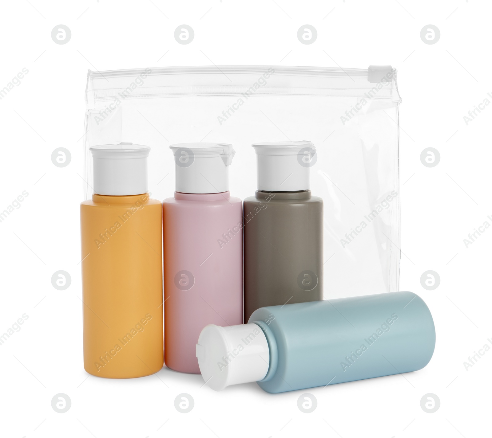 Photo of Cosmetic travel kit with plastic bag isolated on white