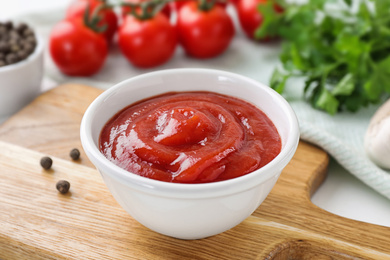 Delicious tomato sauce on white table, closeup