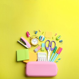 Image of Flat lay composition with school stationery on yellow background, space for text. Back to school