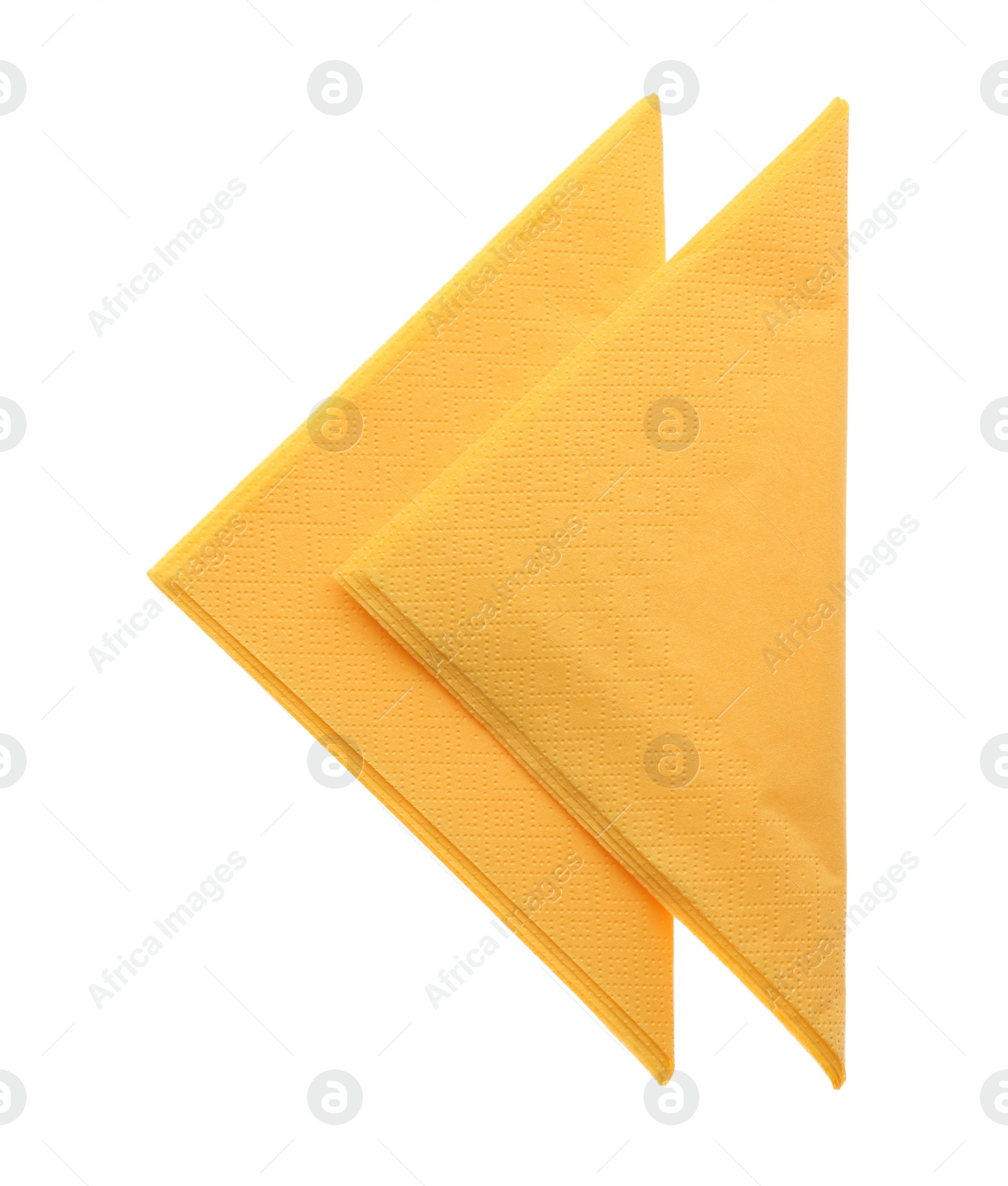 Photo of Folded yellow clean paper tissues on white background, top view