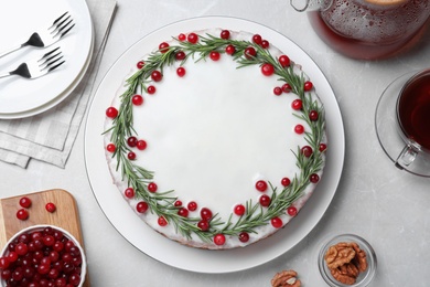 Photo of Flat lay composition with traditional Christmas cake on light grey marble table