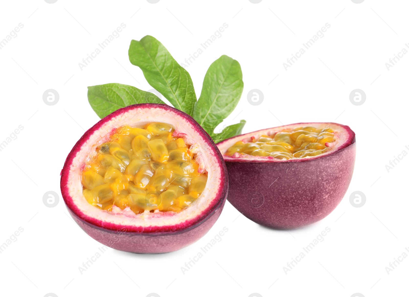 Photo of Cut ripe passion fruit with leaf  isolated on white