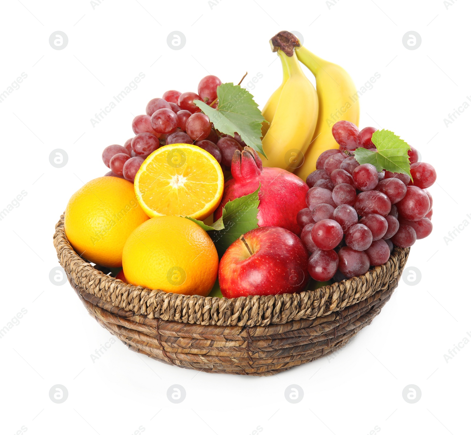 Photo of Wicker basket with different fruits on white background