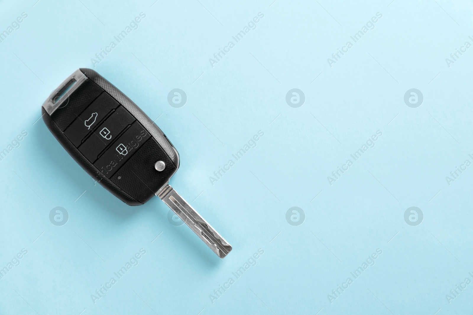 Photo of Car key on color background, top view with space for text