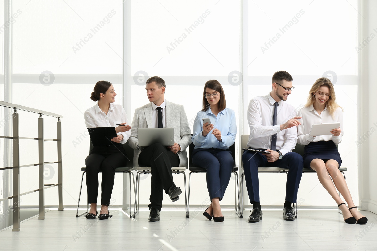 Photo of People waiting for job interview in office hall