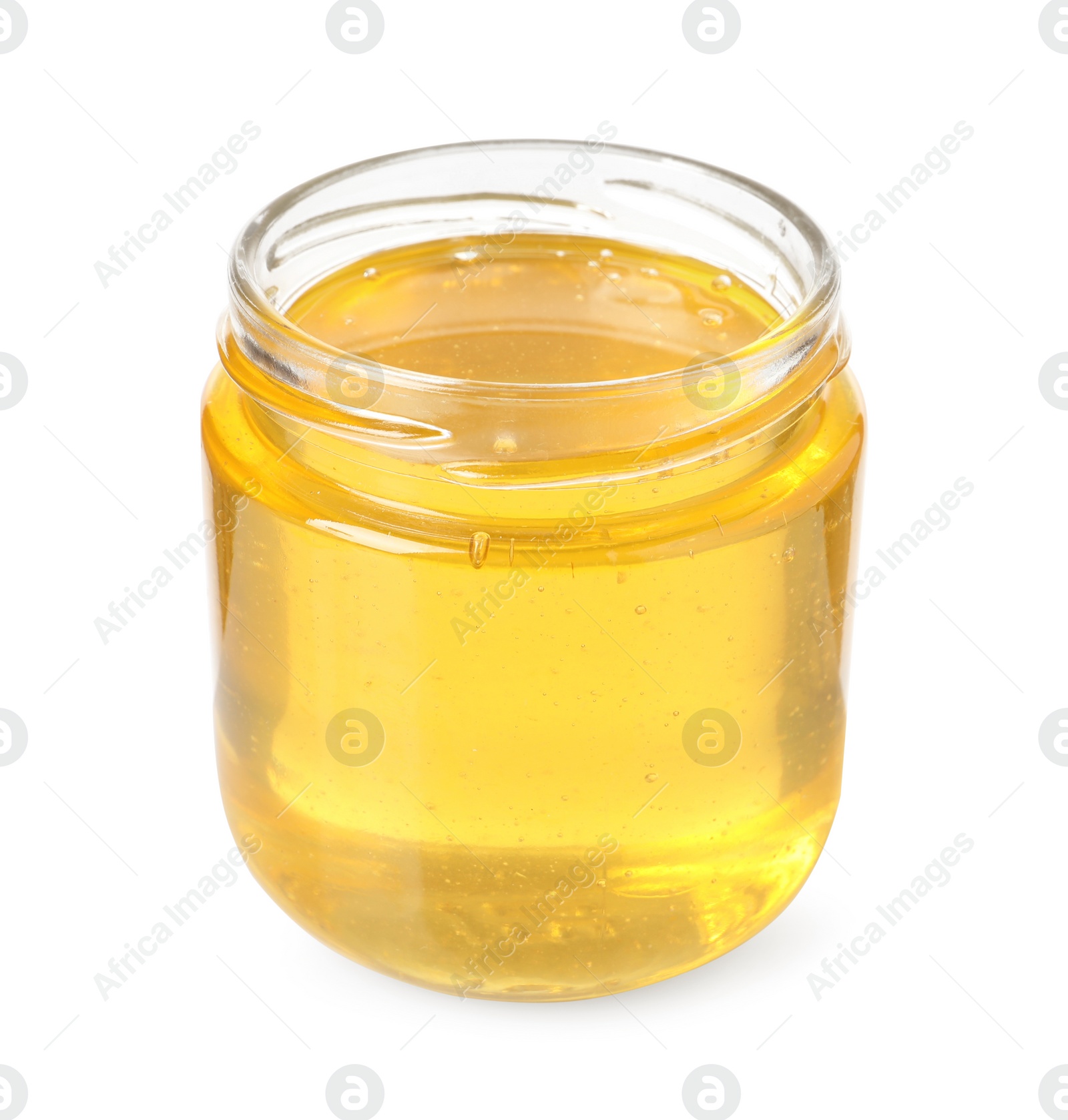 Photo of Tasty honey in glass jar isolated on white