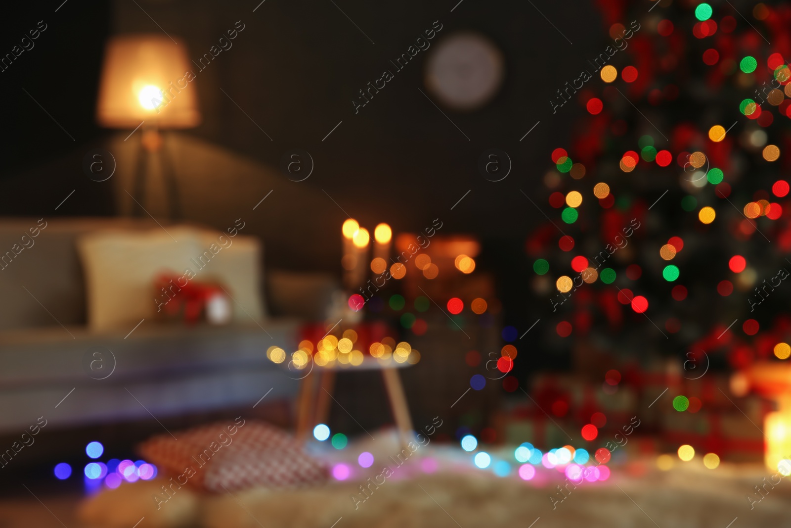 Photo of Blurred view of stylish room interior with decorated Christmas tree