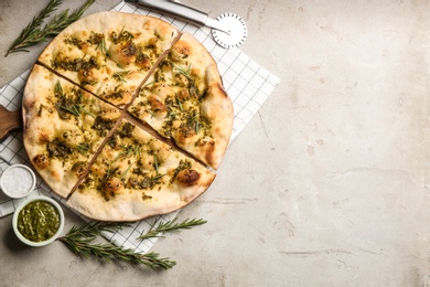 Flat lay composition with focaccia bread on light grey table. Space for text