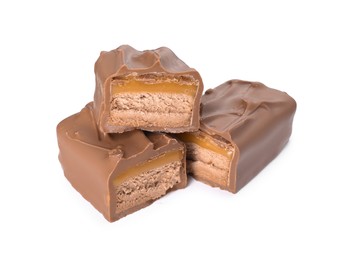 Photo of Pieces of tasty chocolate bars with nougat on white background