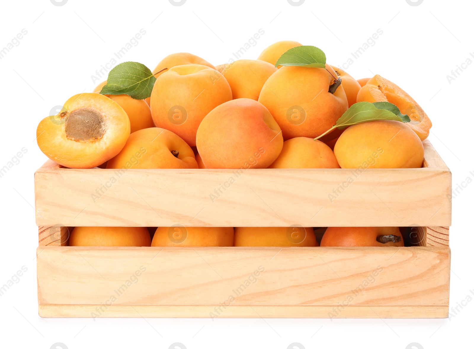 Photo of Wooden crate of delicious ripe sweet apricots isolated on white