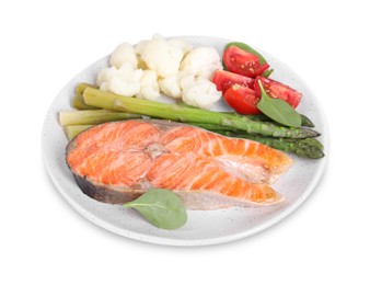 Photo of Healthy meal. Plate with grilled salmon steak and vegetables isolated on white