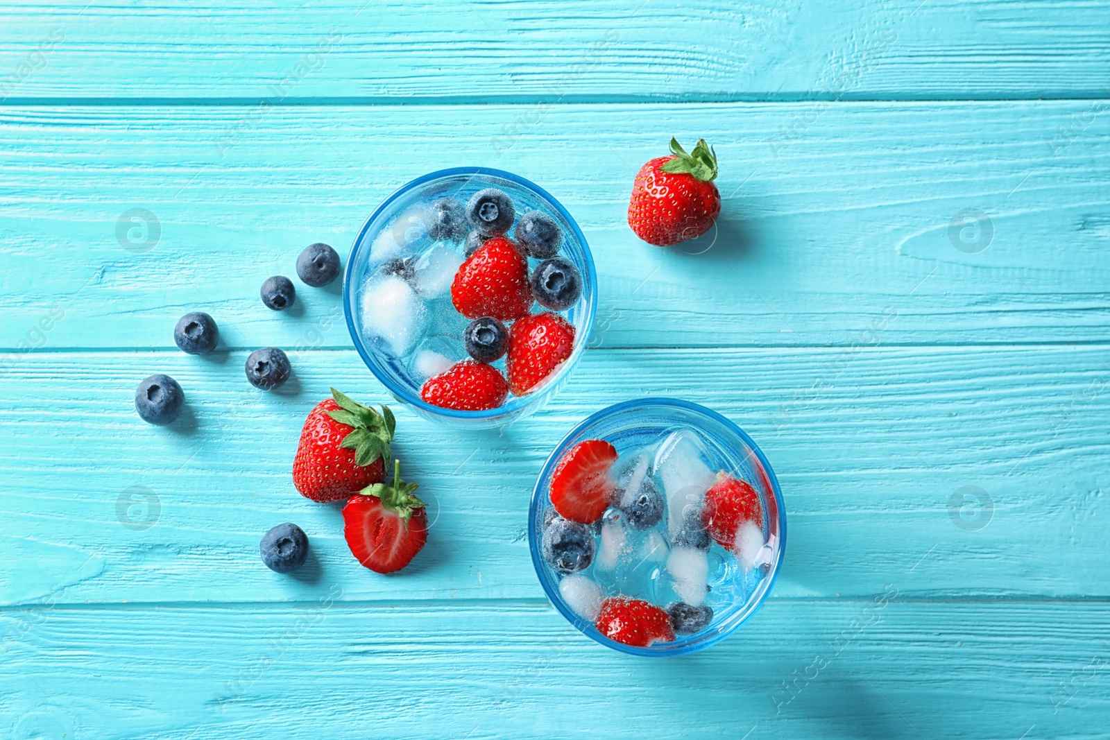 Photo of Flat lay composition with natural lemonade on wooden background