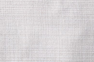 Photo of Texture of white fabric as background, top view