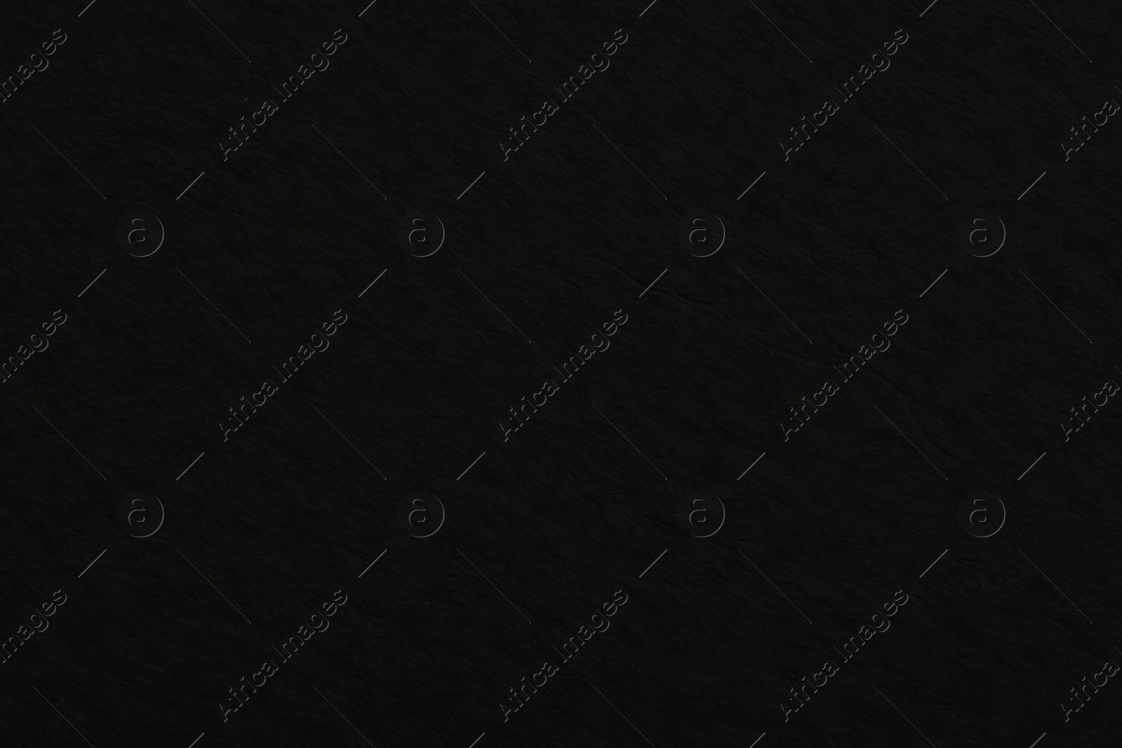 Photo of Texture of black paper sheet as background, top view