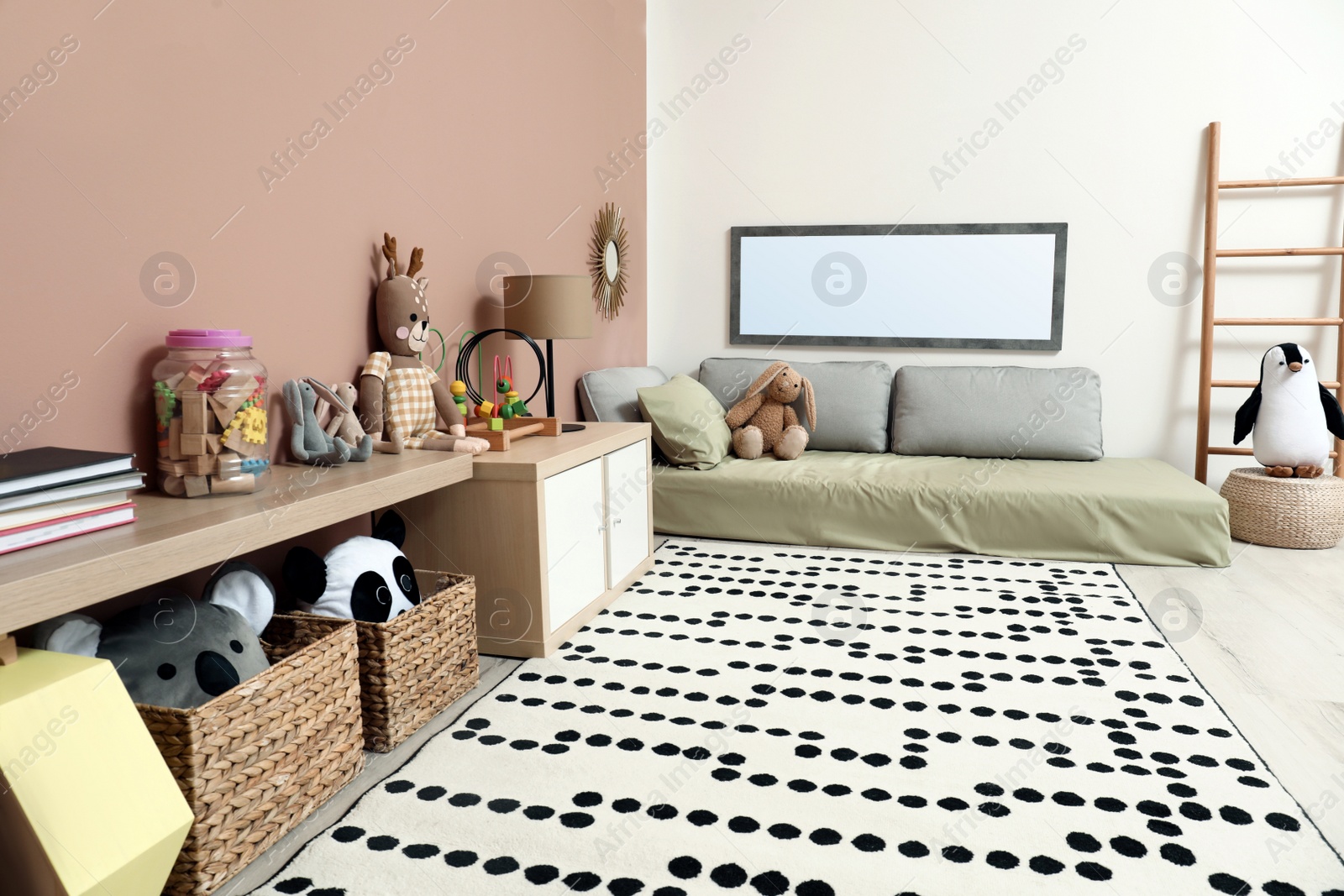 Photo of Montessori bedroom interior with floor bed and toys