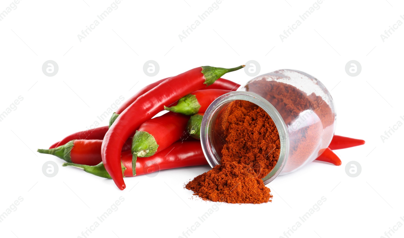 Photo of Fresh chili peppers and jar of paprika powder on white background