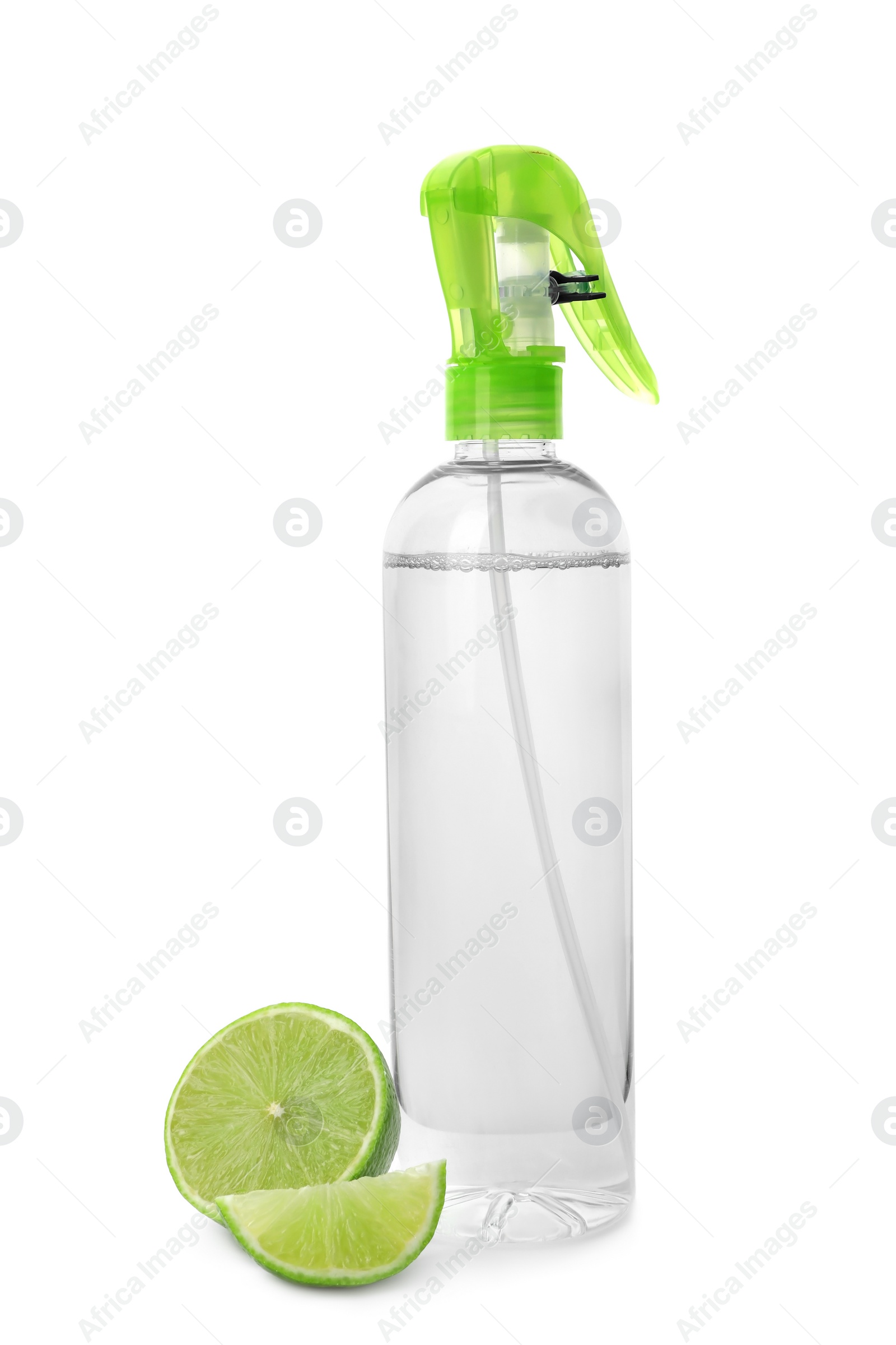 Photo of Bottle of air freshener and lime on white background