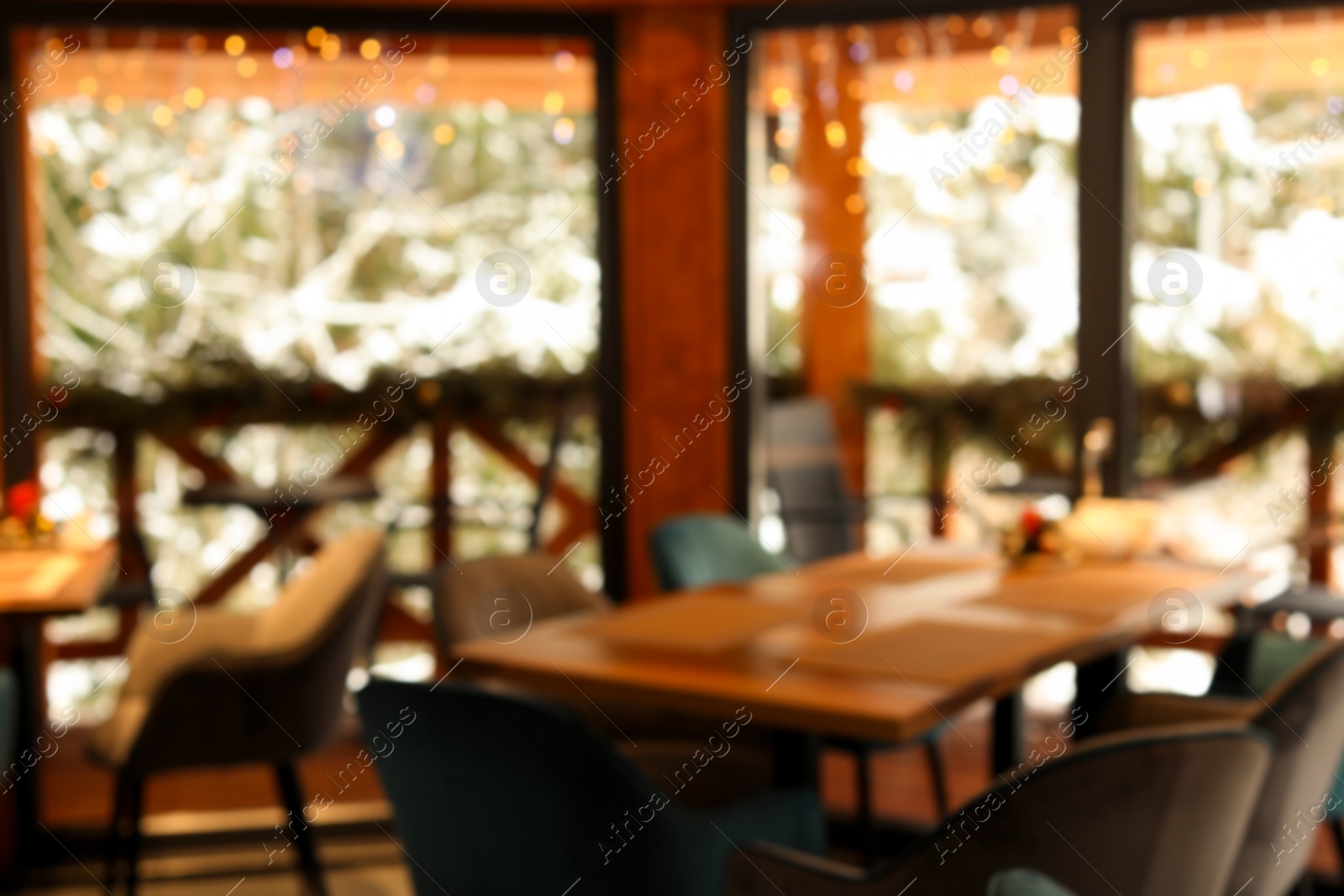 Photo of Blurred view of modern cafe interior with new stylish furniture