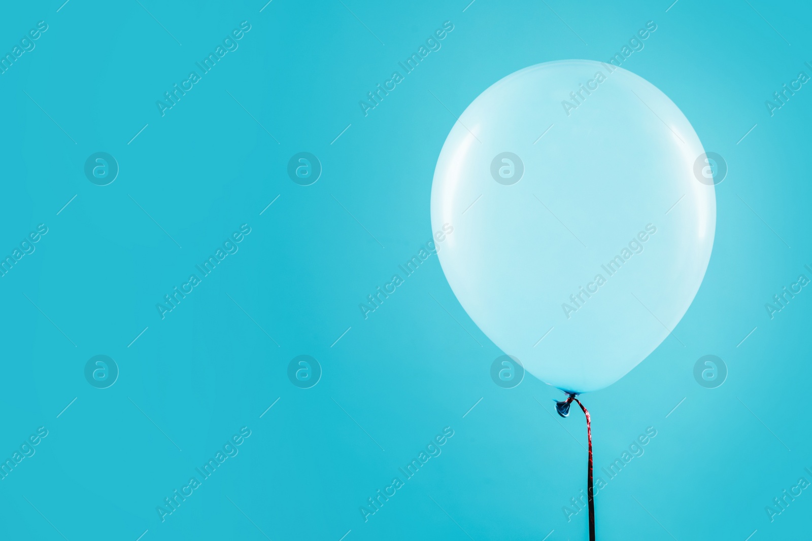 Photo of Bright balloon on color background, space for text. Celebration time