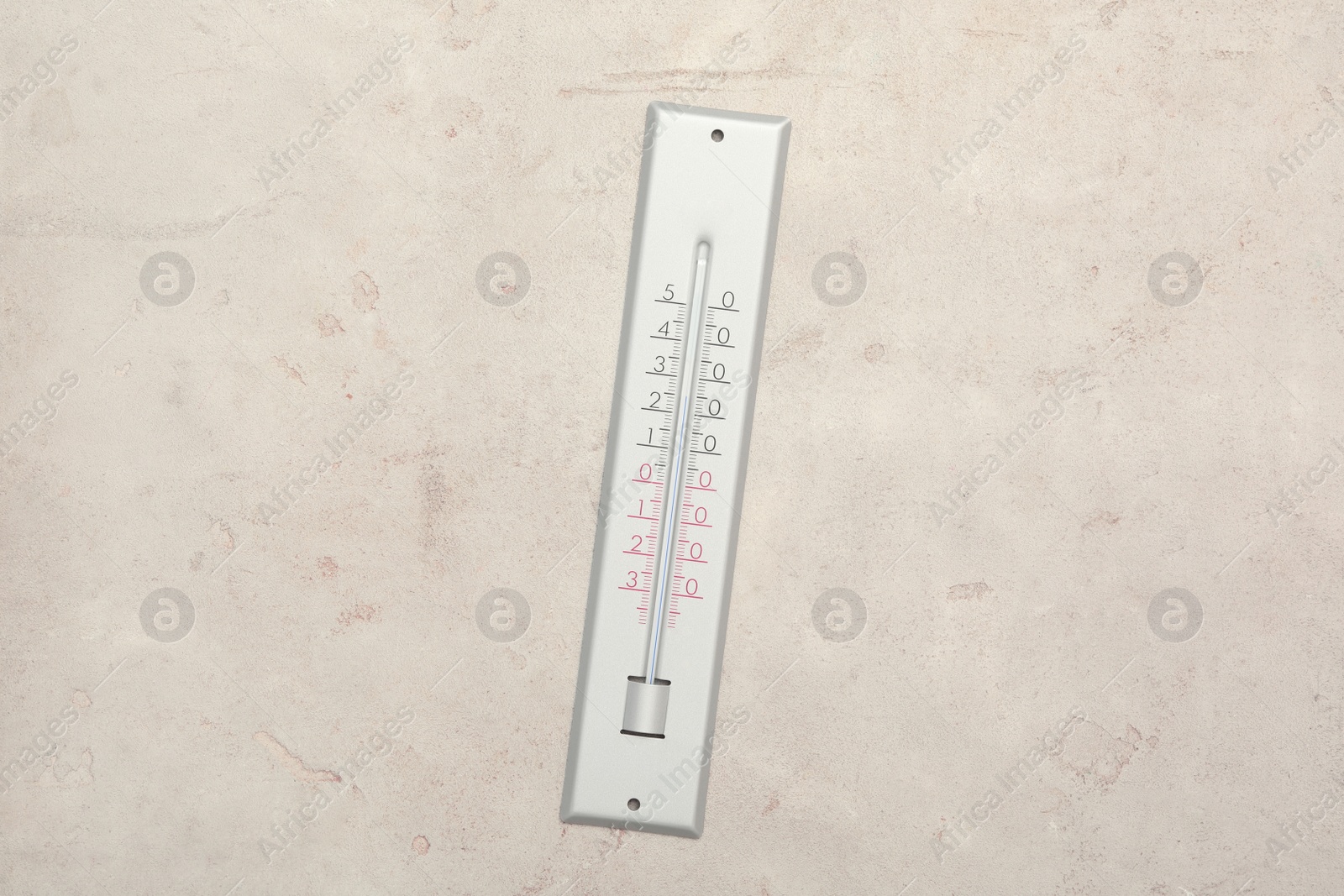 Photo of Weather thermometer on light background, top view