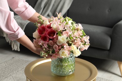 Photo of Woman with beautiful bouquet of fresh flowers indoors, closeup