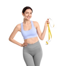 Happy young woman with measuring tape showing her slim body against white background