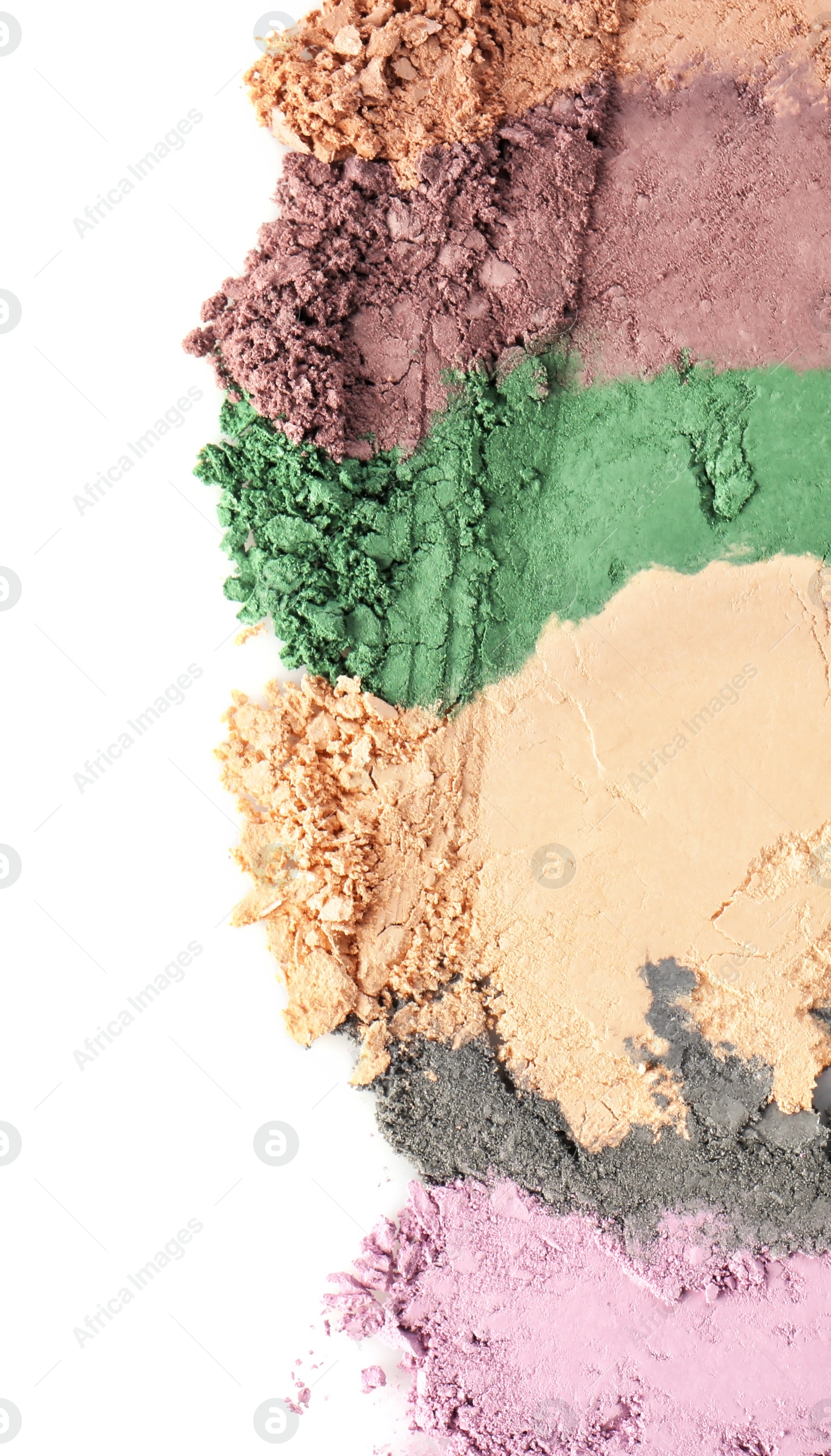 Photo of Crushed eye shadows on white background. Professional makeup products