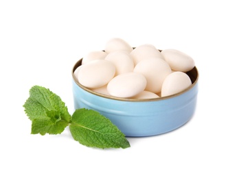 Open box with tasty mint candies on white background