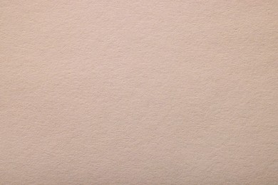 Photo of Texture of light grey paper sheet as background, top view