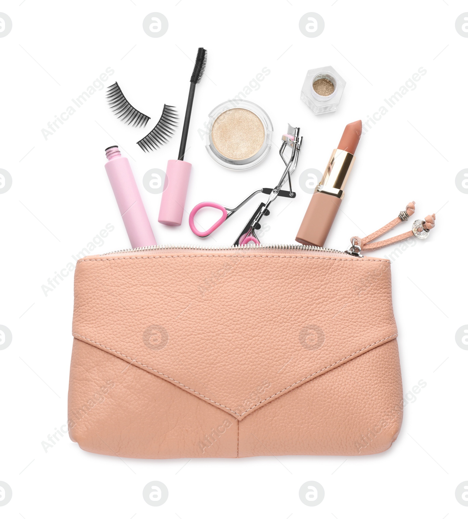 Photo of Cosmetic bag with eyelash curler and makeup products on white background, top view