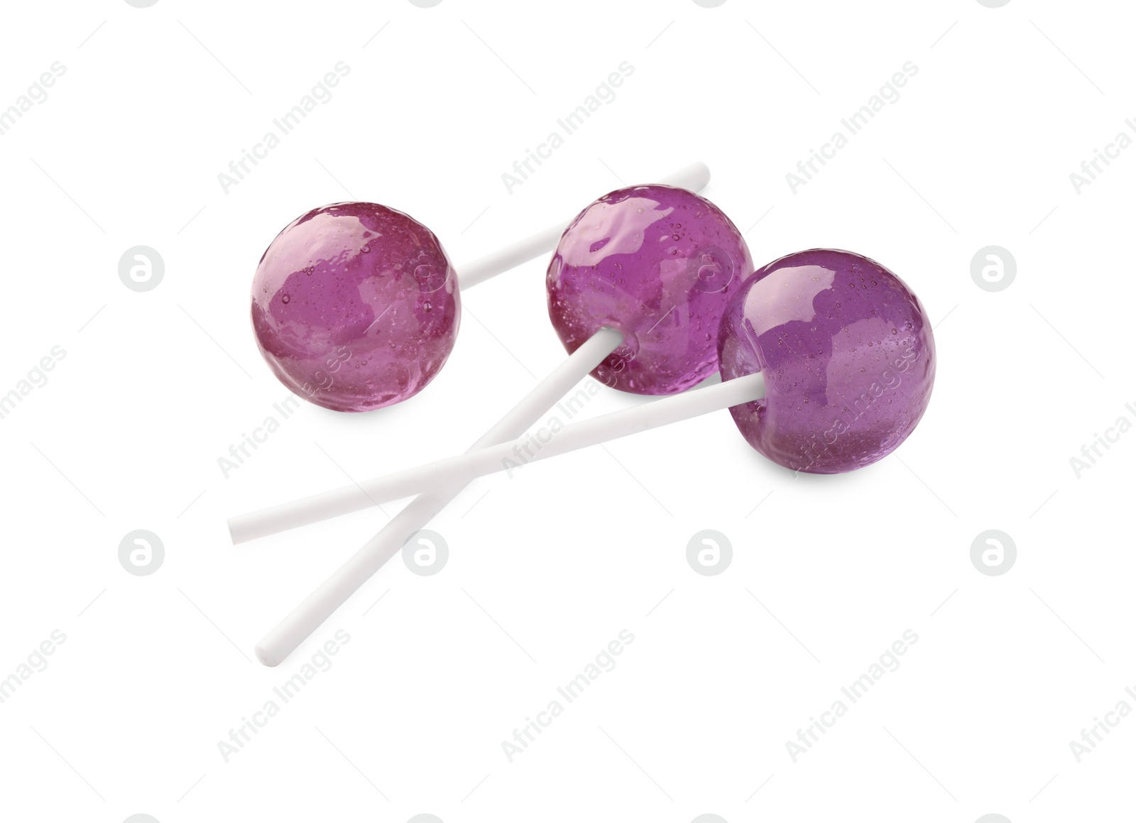 Photo of Many sweet purple lollipops isolated on white