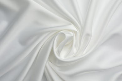 Texture of crumpled white silk fabric as background, top view