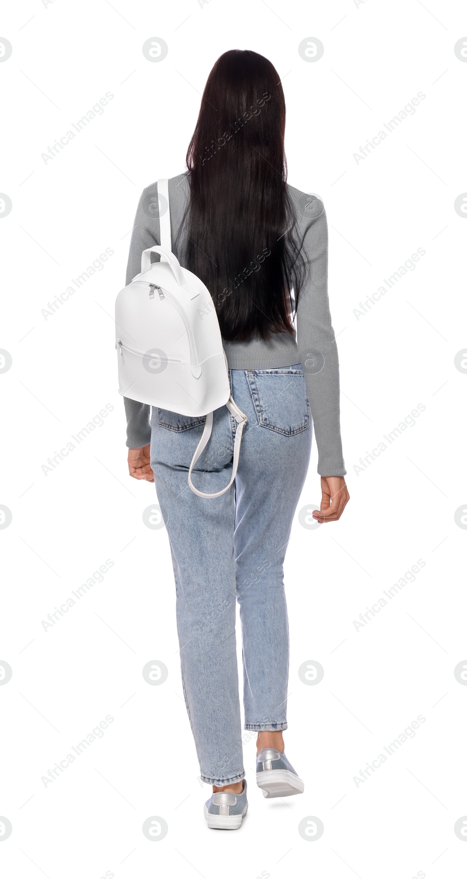 Photo of Woman with leather bag walking on white background, back view