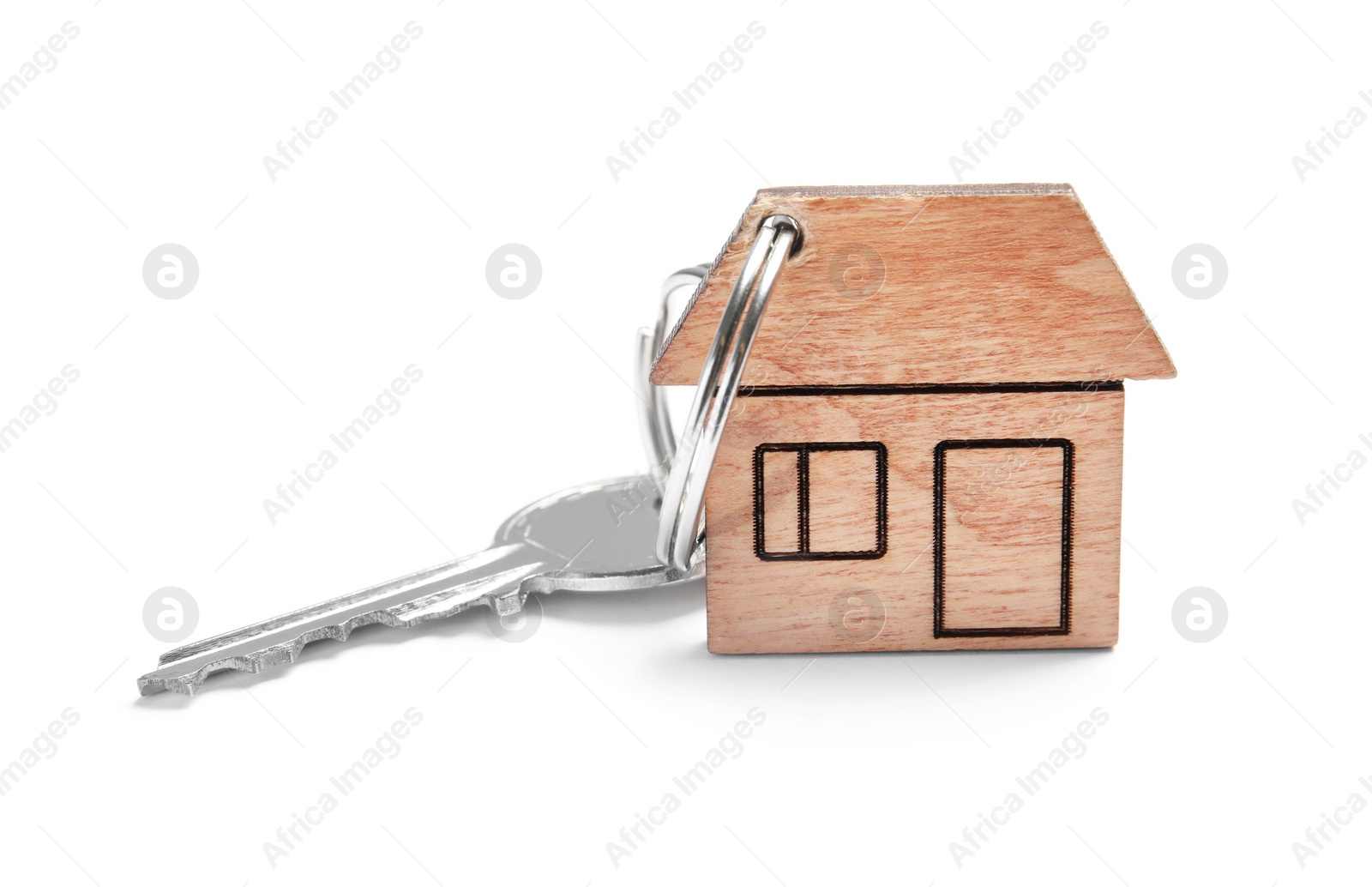 Photo of House key with trinket on white background