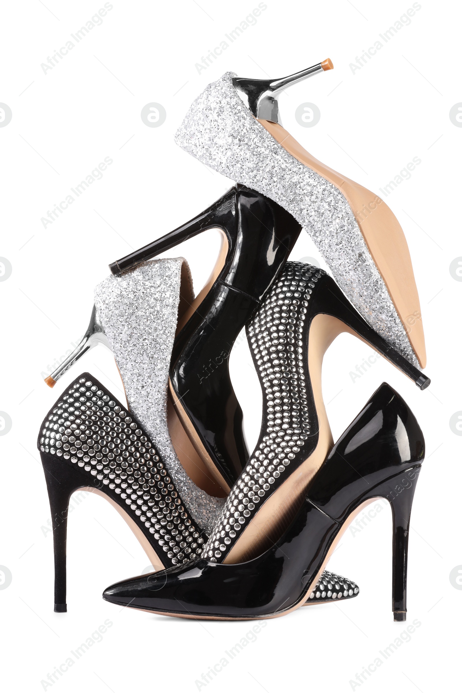 Photo of Pile of different high heels isolated on white