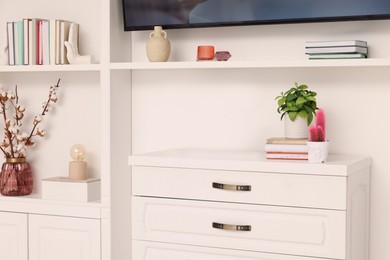 Photo of Shelves with different decor in room. Interior design