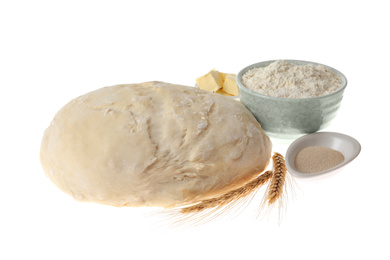 Raw dough and ingredients for pastries isolated on white