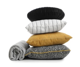 Stylish soft pillows and blanket on white background