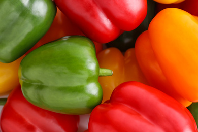 Photo of Fresh ripe colorful bell peppers as background, closeup