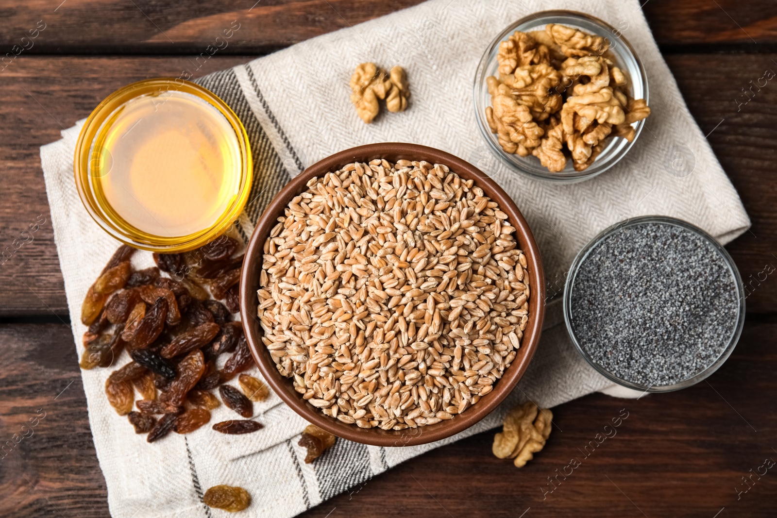 Photo of Ingredients for traditional kutia on wooden table, flat lay