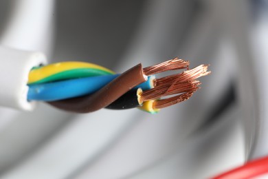 Photo of Colorful electrical wire on blurred background, closeup