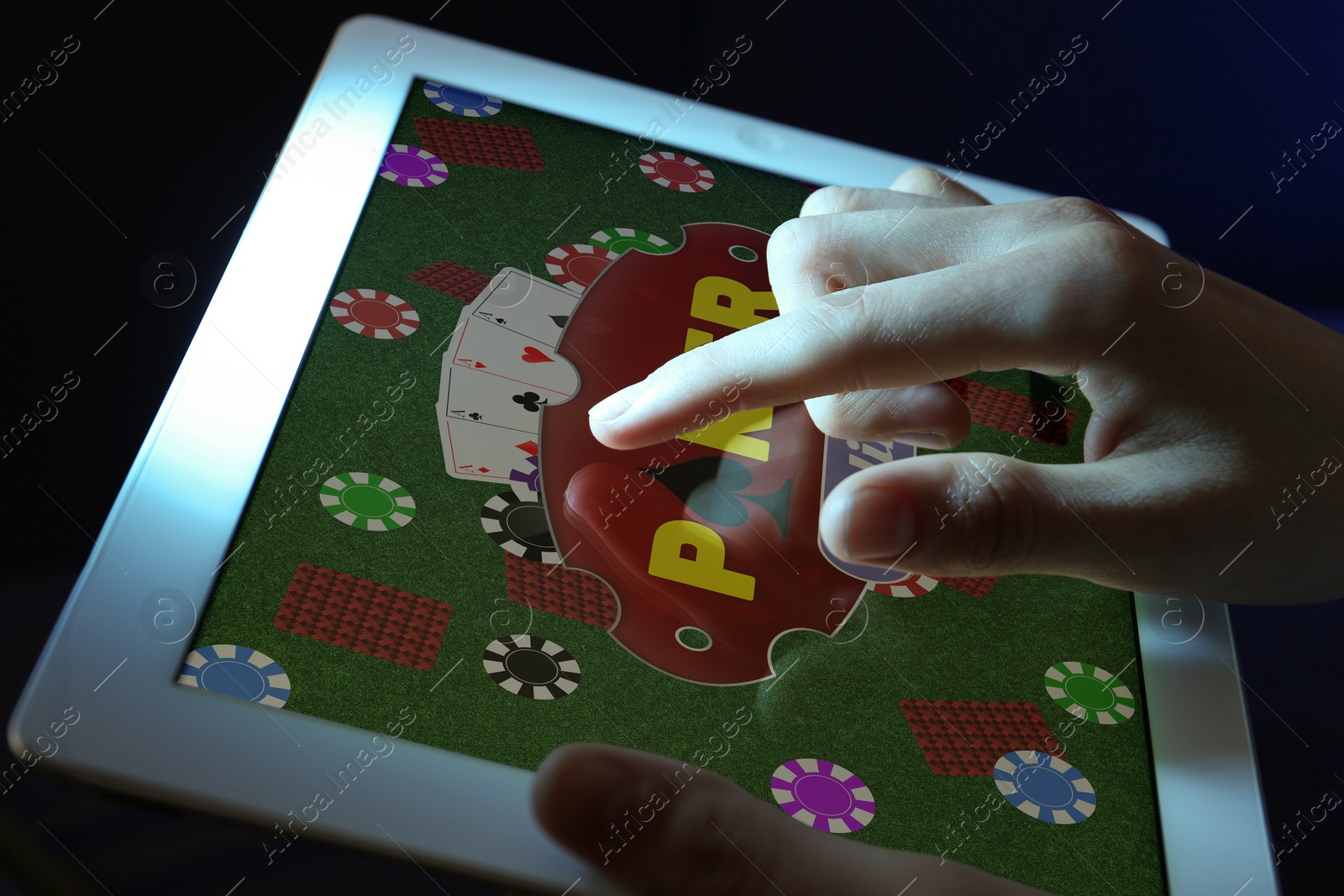 Image of Woman playing poker on tablet, closeup. Casino online