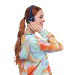 Young woman in sportswear and headphones on white background