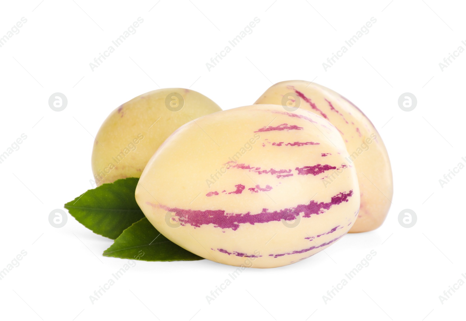 Photo of Fresh ripe pepino melons and green leaves on white background