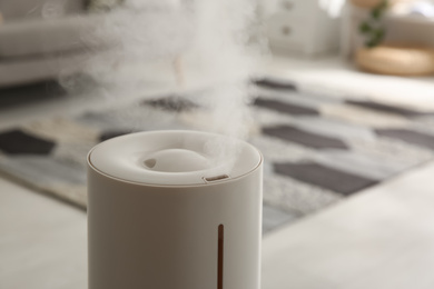 Photo of Modern humidifier indoors, closeup. Space for text