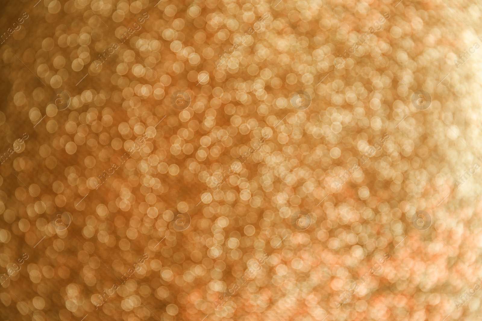 Photo of Gold glitter with bokeh effect as background, closeup