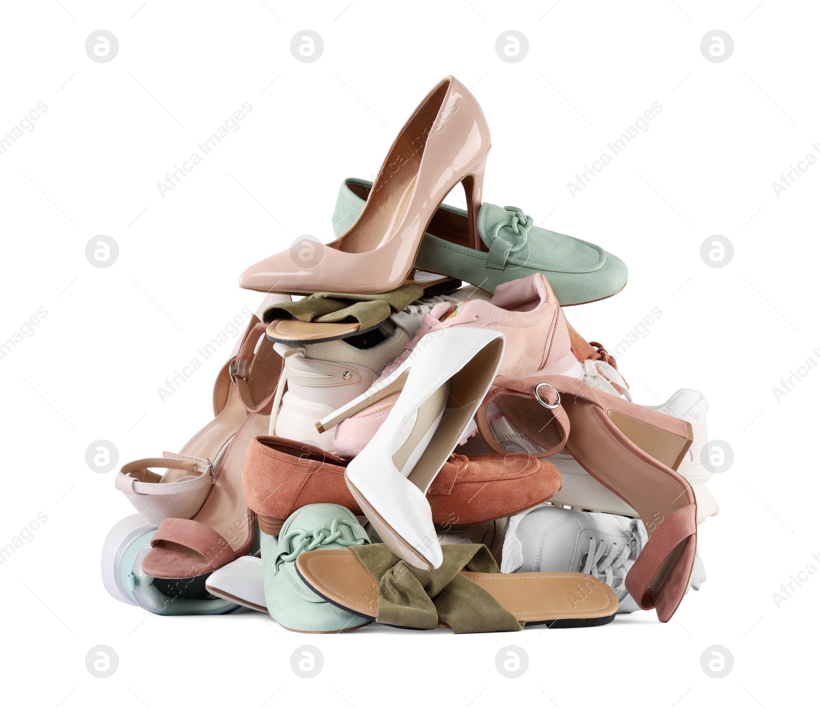 Photo of Pile of different female shoes isolated on white