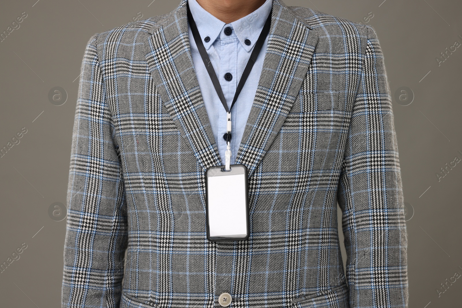 Photo of Man with blank badge on grey background, closeup