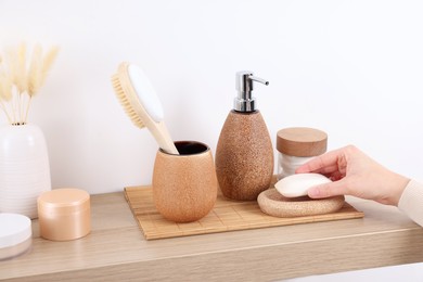 Photo of Bath accessories. Woman with soap indoors, closeup