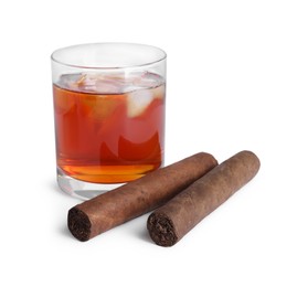 Glass of whiskey and cigars isolated on white